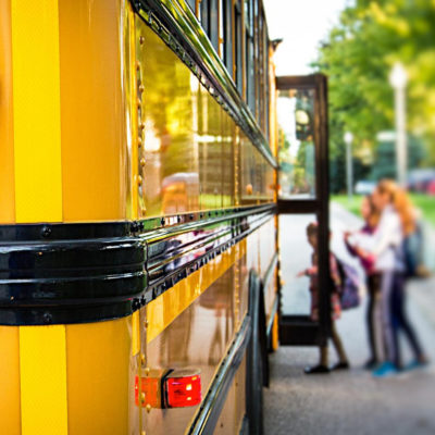 Students getting on a school bus