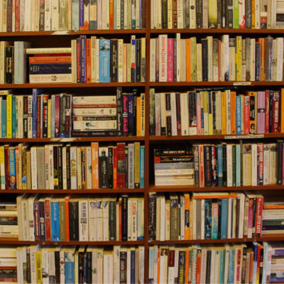 Hundreds of books stacked on book shelves