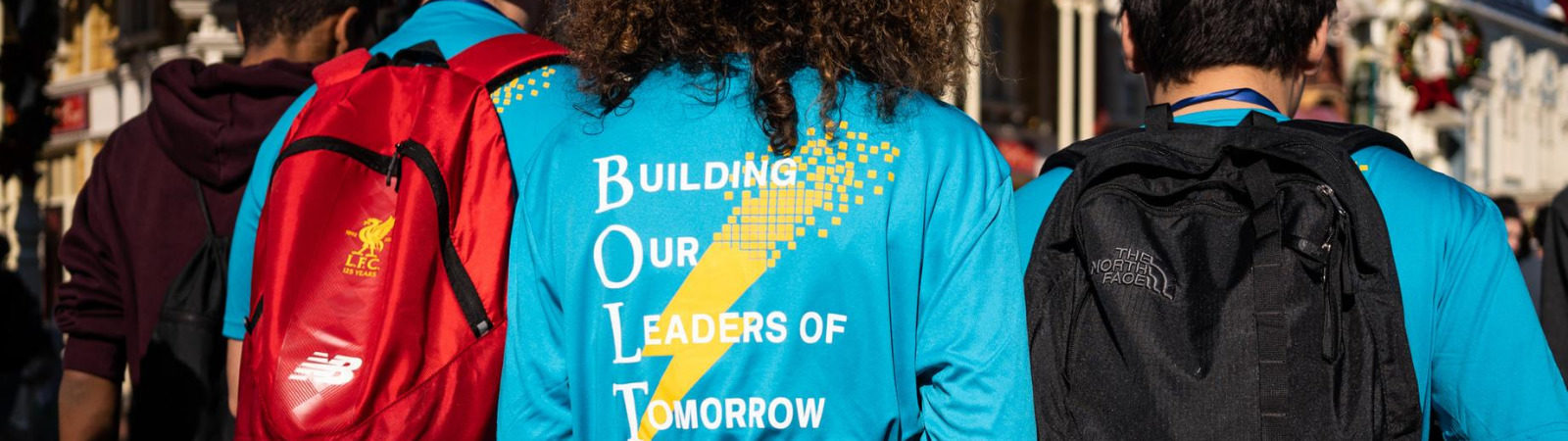 Back of student's shirt featuring BOLT program text "building our leaders of tomorrow"