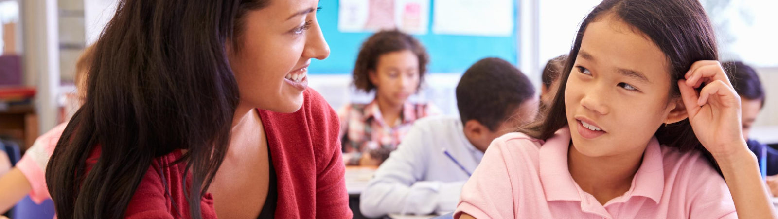 teacher working with student