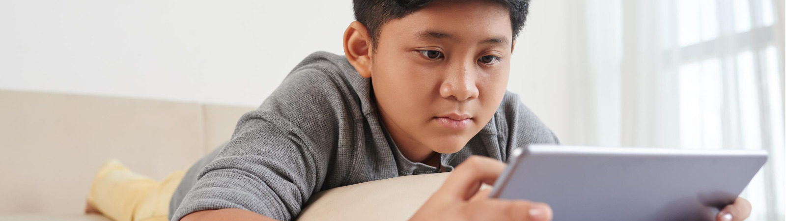 Child reading on a tablet