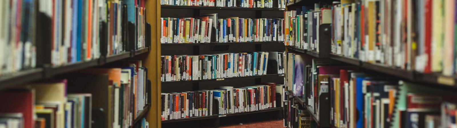 Picture of many shelves of books at a library